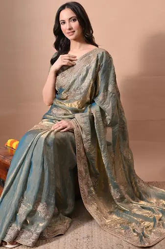Women's turquoise embellished soft silk blend saree with unstitched piece