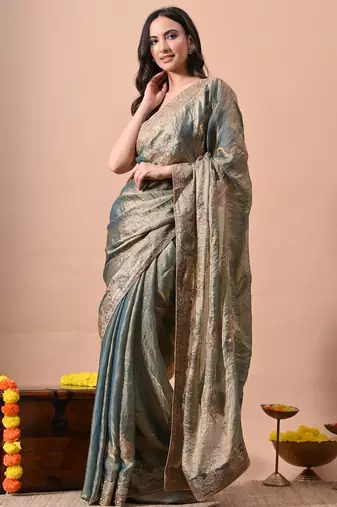 Women's turquoise embellished soft silk blend saree with unstitched piece