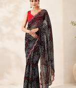Black bandhani printed saree with mirror work & cutwork border