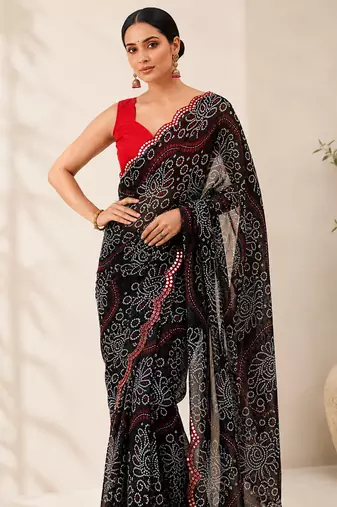 Black bandhani printed saree with mirror work & cutwork border