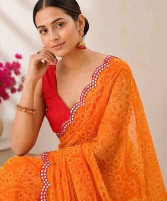 Orange bandhani printed saree with mirror work & cutwork border 2