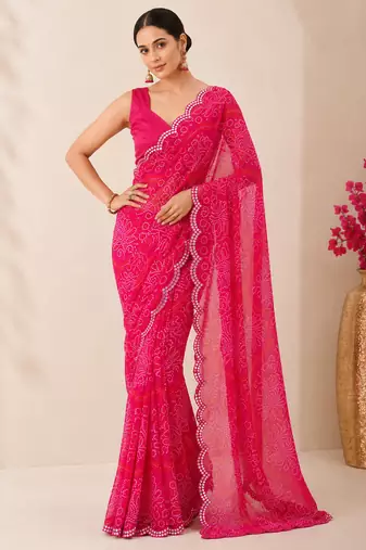 Pink bandhani printed saree with mirror work & cutwork border