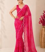 Pink bandhani printed saree with mirror work & cutwork border