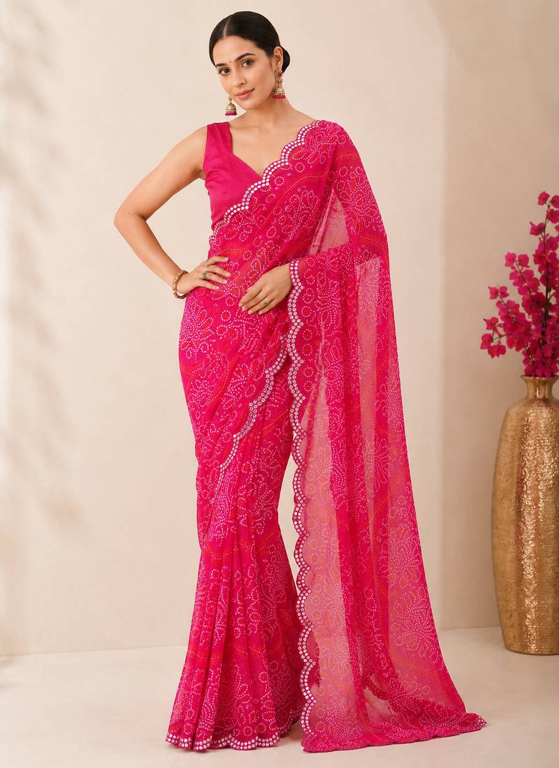 Pink bandhani printed saree with mirror work & cutwork border
