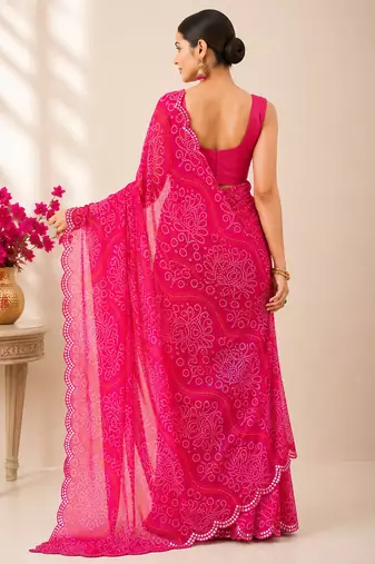 Pink bandhani printed saree with mirror work & cutwork border