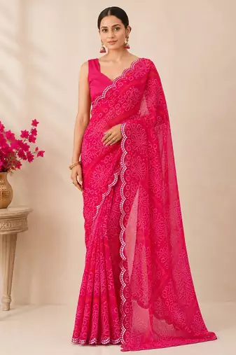 Pink bandhani printed saree with mirror work & cutwork border