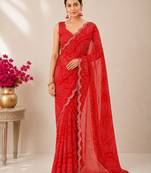 Red bandhani printed saree with mirror work & cutwork border