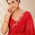 Red bandhani printed saree with mirror work & cutwork border