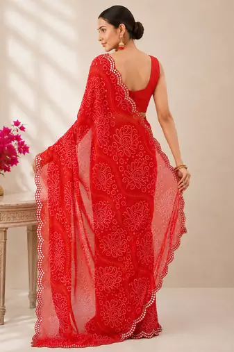 Red bandhani printed saree with mirror work & cutwork border