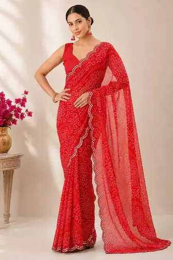 Red bandhani printed saree with mirror work & cutwork border