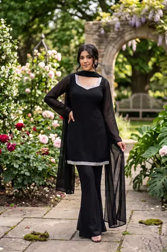 Women black georgette bell sleeve kurta with flared sharara & dupatta set