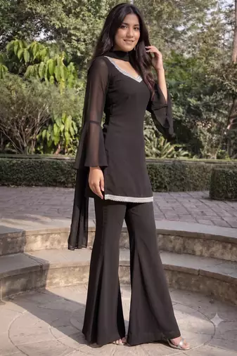 Women black georgette bell sleeve kurta with flared sharara & dupatta set
