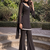 Women black georgette bell sleeve kurta with flared sharara & dupatta set