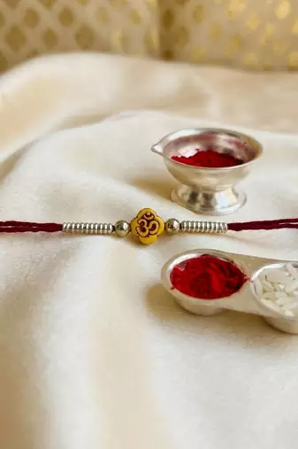 12 pieces combo multi color om design thread rakhis