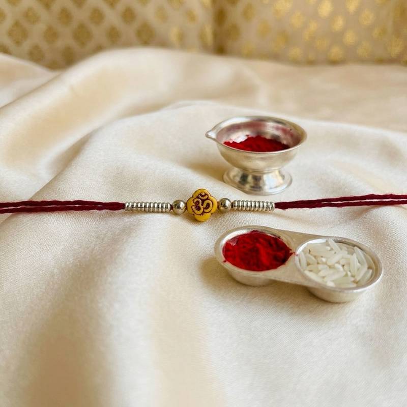 12 pieces combo multi color om design thread rakhis