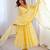 Yellow faux georgette embroidered flared gown set