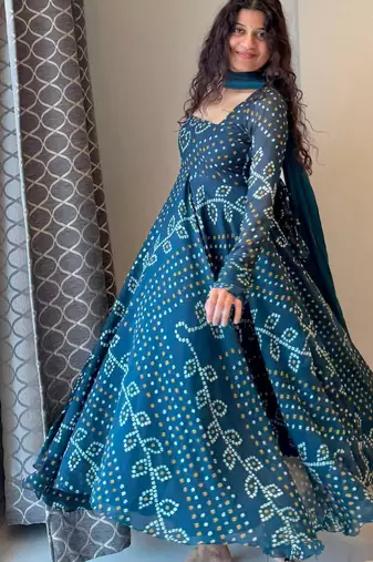 Teal-blue faux georgette embroidered flared gown set