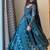 Teal-blue faux georgette embroidered flared gown set