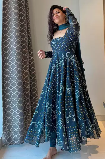 Teal-blue faux georgette embroidered flared gown set