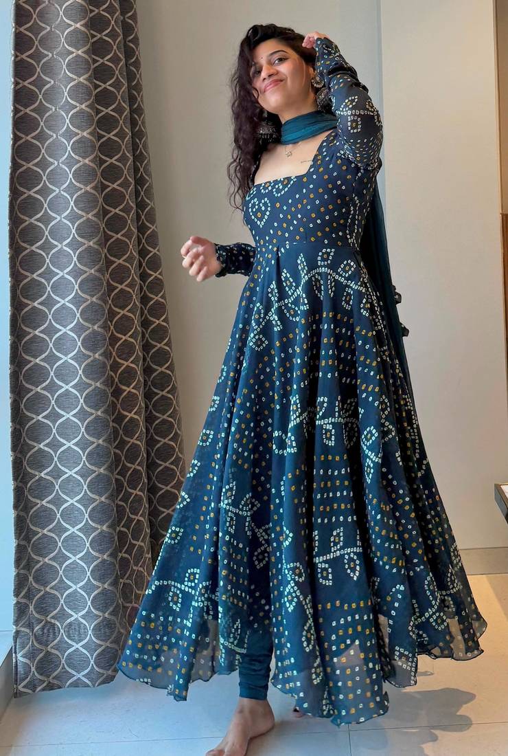 Teal-blue faux georgette embroidered flared gown set