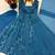 Teal-blue faux georgette embroidered flared gown set