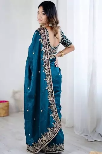 Blue jimmy choo zari butti work embellished wedding wear saree