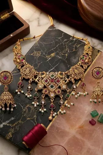 Antique gold plated peacock motif multicolor stone studded temple choker necklace set with matching jhumka