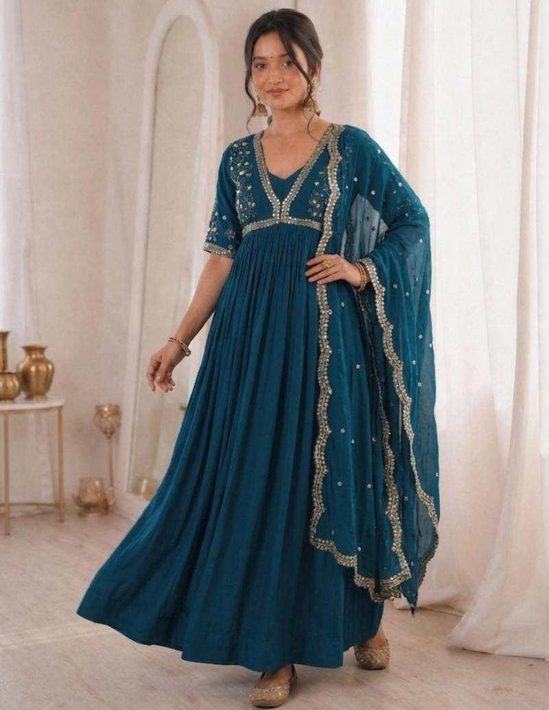 Teal-blue faux georgette embroidered flared gown set