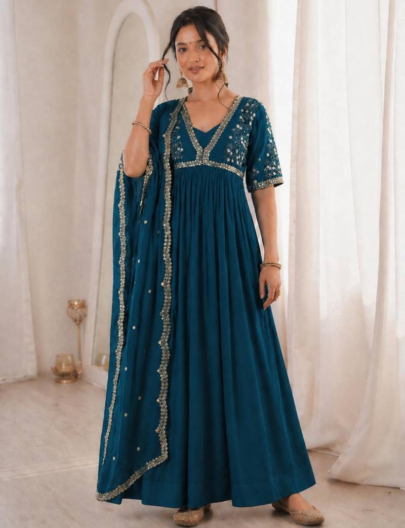 Teal-blue faux georgette embroidered flared gown set
