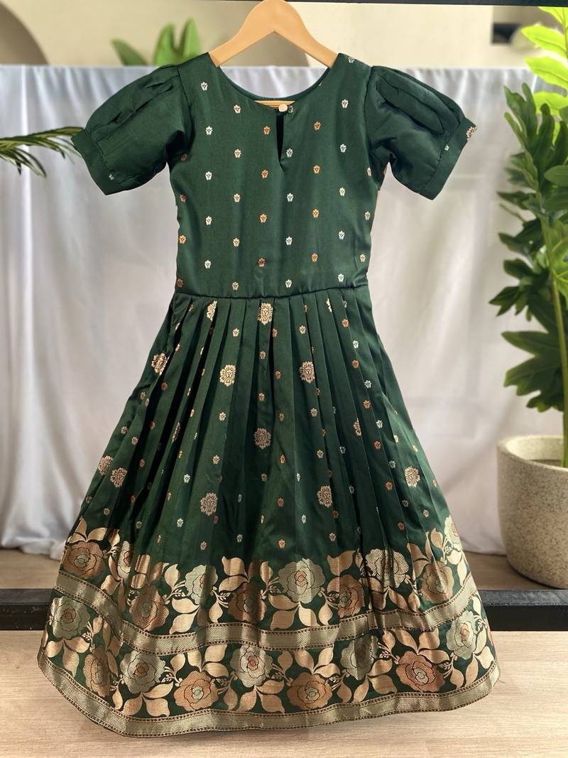 Charming girls frock with intricate floral weaving and a stylish panel design