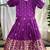 Charming girls frock with intricate floral weaving and a stylish panel design