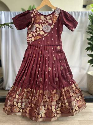 Charming girls frock with intricate floral weaving and a stylish panel design 1