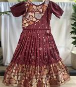 Charming girls frock with intricate floral weaving and a stylish panel design