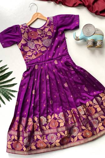 Charming girls frock with intricate floral weaving and a stylish panel design