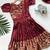 Charming girls frock with intricate floral weaving and a stylish panel design