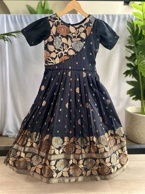 Charming girls frock with intricate floral weaving and a stylish panel design 1