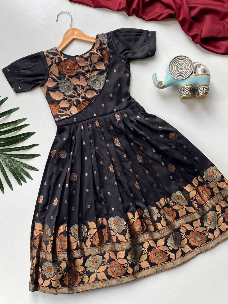 Charming girls frock with intricate floral weaving and a stylish panel design