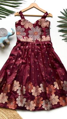 Charming girls frock with intricate floral weaving and a stylish panel design 1