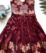 Charming girls frock with intricate floral weaving and a stylish panel design