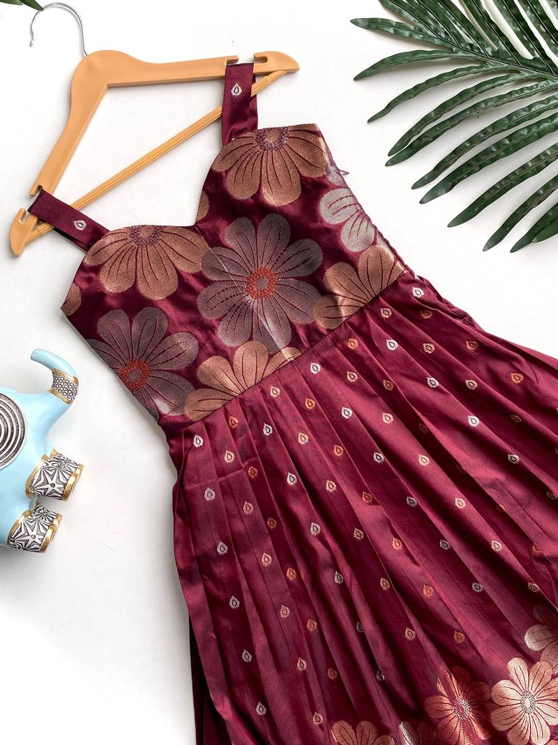 Charming girls frock with intricate floral weaving and a stylish panel design