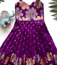 Charming girls frock with intricate floral weaving and a stylish panel design