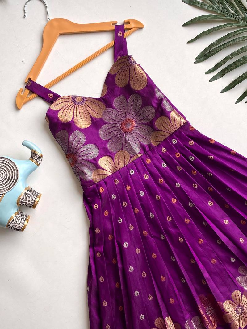 Charming girls frock with intricate floral weaving and a stylish panel design