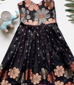 Charming girls frock with intricate floral weaving and a stylish panel design