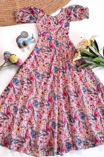 Light pink floral flare dress with puff sleeves and a round neckline