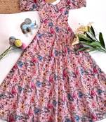 Light pink floral flare dress with puff sleeves and a round neckline