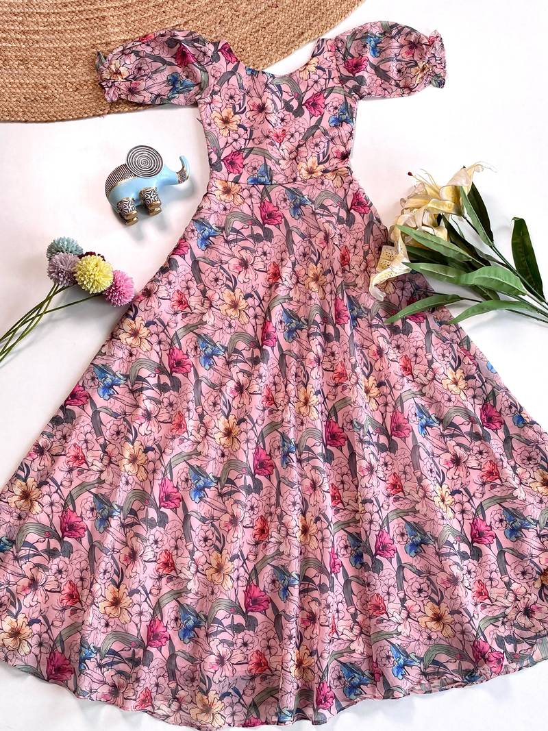 Light pink floral flare dress with puff sleeves and a round neckline