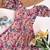 Light pink floral flare dress with puff sleeves and a round neckline