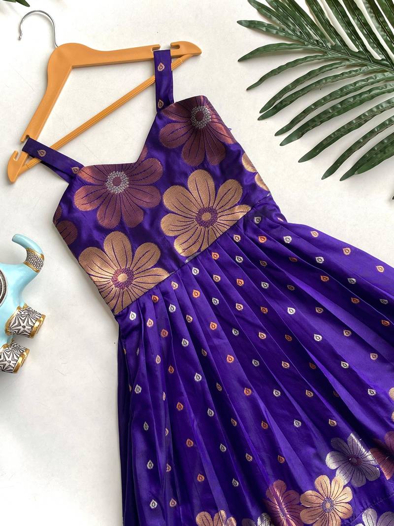 Charming girls frock with intricate floral weaving and a stylish panel design
