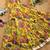 Yellow tussar silk gown for girls features a vibrant pen kalamkari floral print