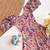 Light pink floral flare dress with puff sleeves and a round neckline